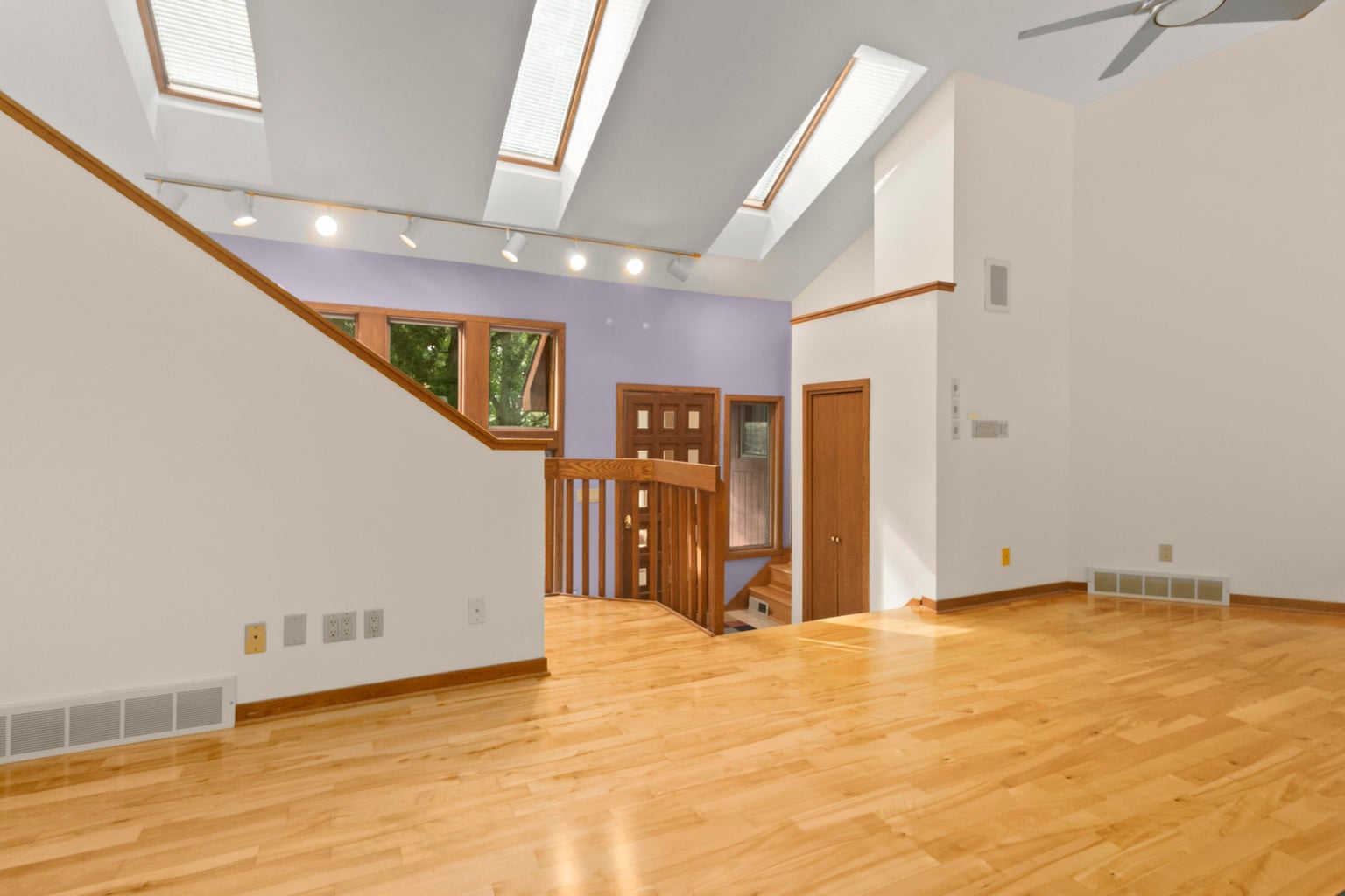 20260812183215937328000000-o large open room with skylights
