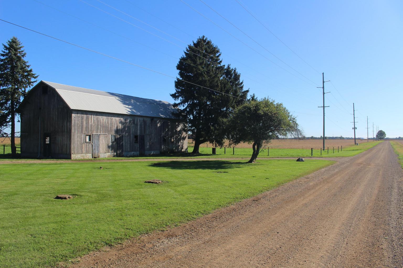 barn view down open gravel road
