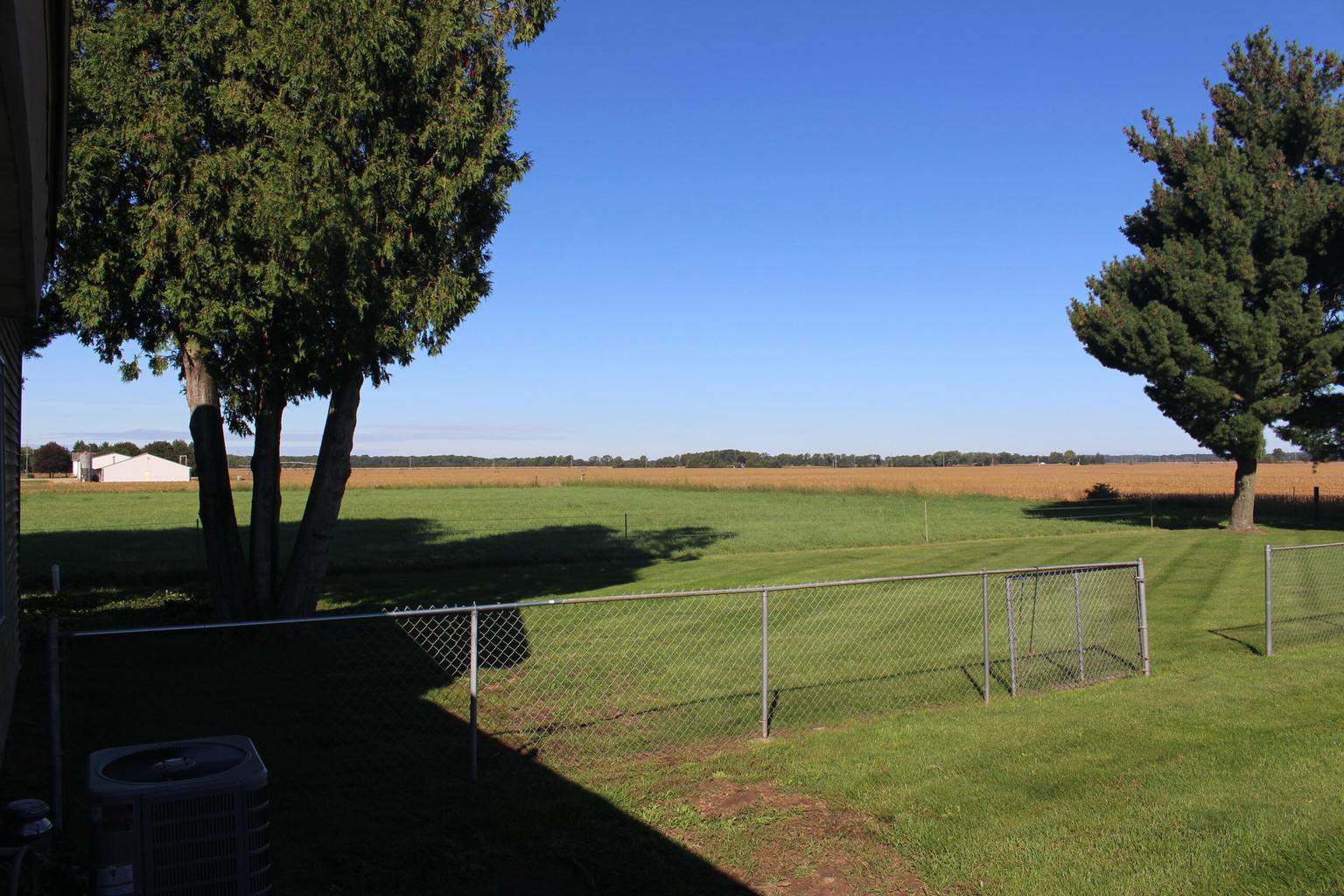 fence in open yard and field