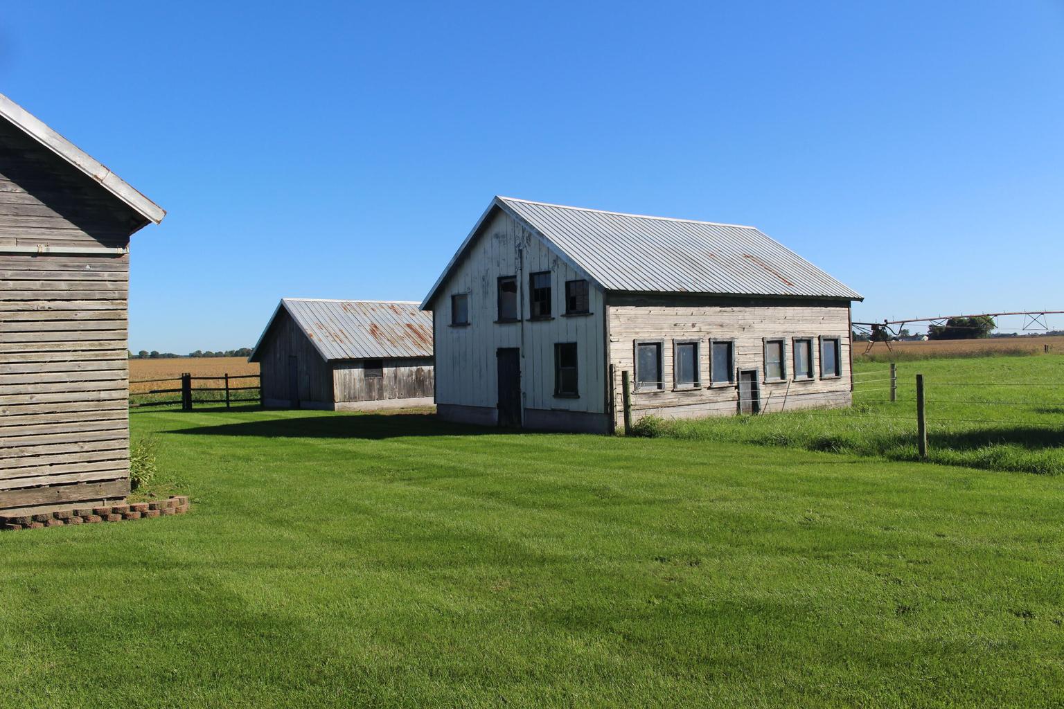 small outbuilding with many windows