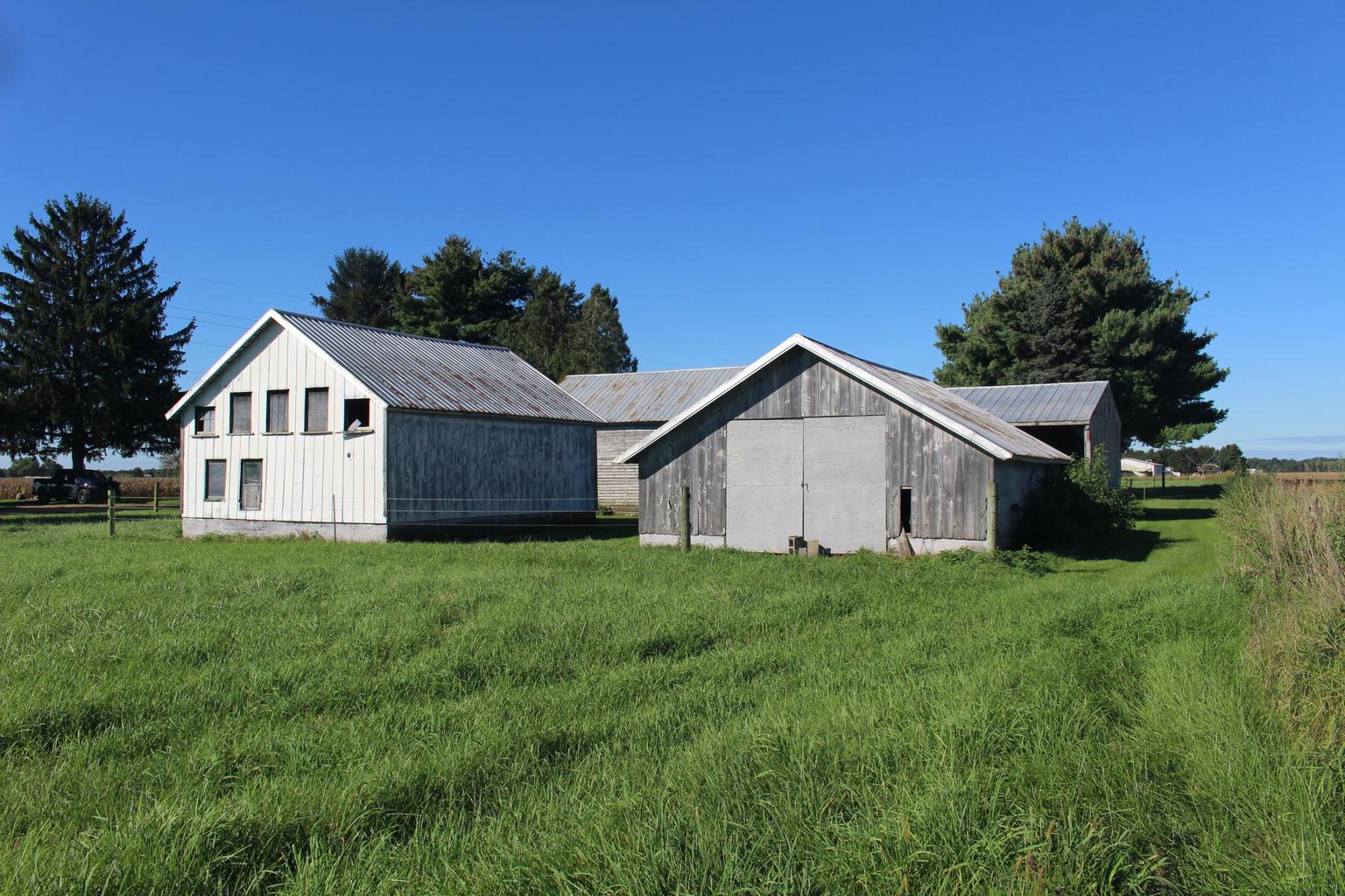 back view of outbuildings and grassy area