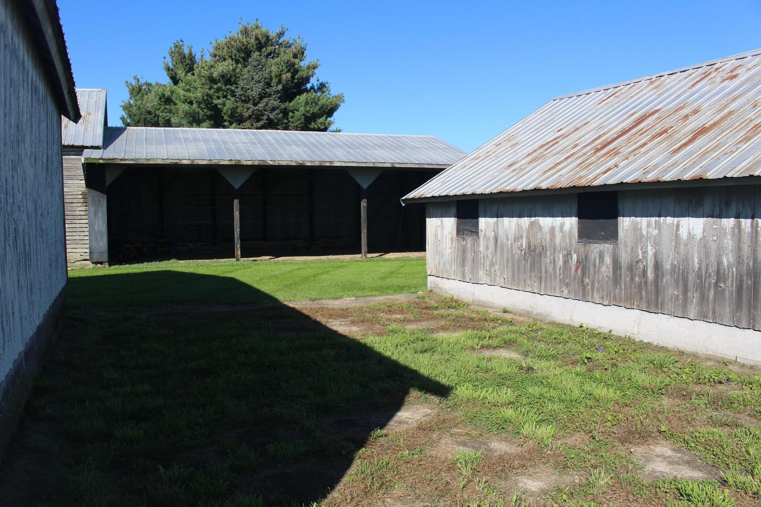 area between three outbuildings