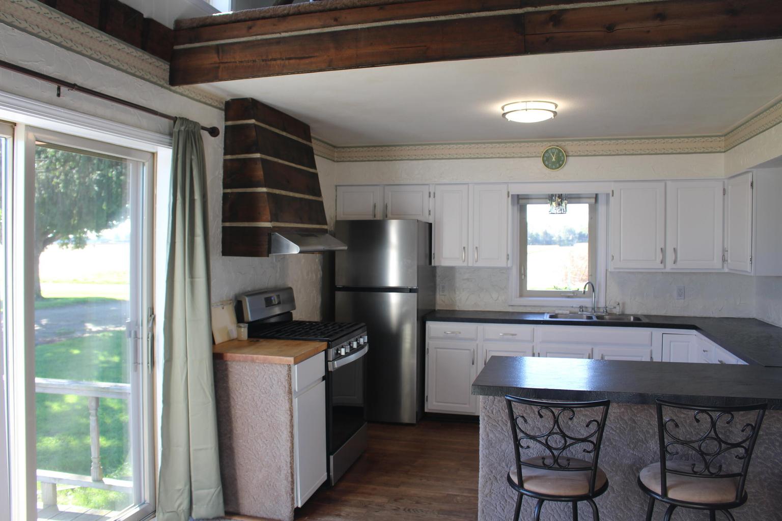 kitchen with stainless refrigerator