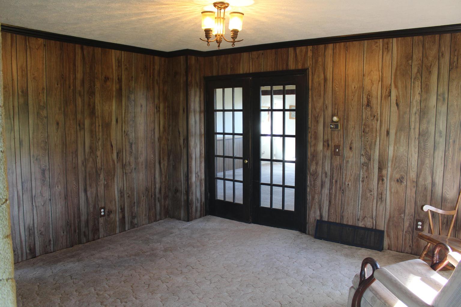 paneled room with french doors