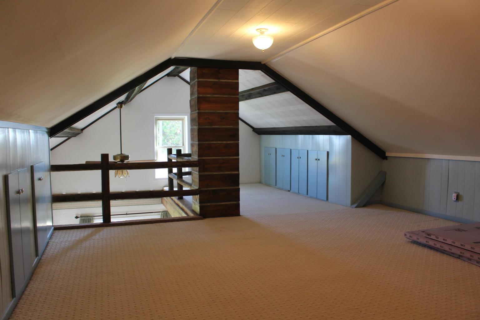 upstairs with vaulted ceiling