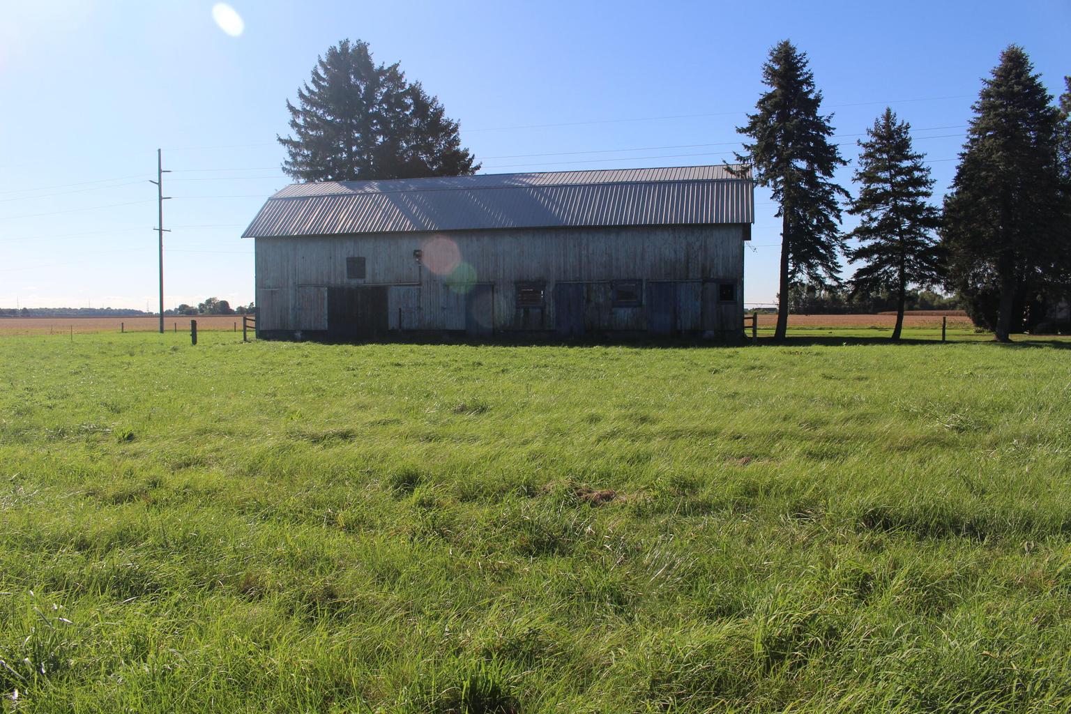 barn across green field